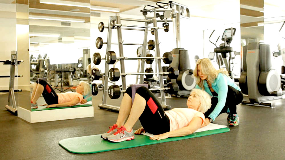 Young man with muscular body in blue jeans Personal Trainer